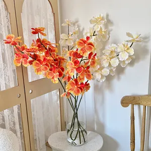 3D printed orange and white orchids in a glass vase for home and hotel decoration