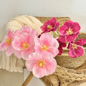 3D printed artificial tulips in pink and magenta colors displayed in a woven basket