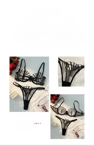 Detail of black sheer striped lingerie set with lace texture and mesh fabric on white fur