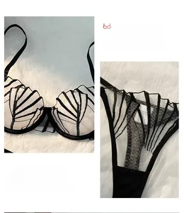 Detailed view of black and white striped mesh lingerie set with shell patterns
