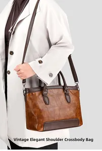 Retro brown crocodile pattern leather handbag shown on a model's shoulder for daily styling