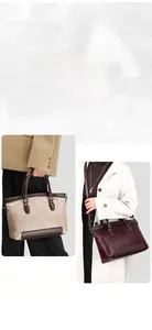 Detail of vintage stone-embossed tote bags in beige and burgundy with metal chains