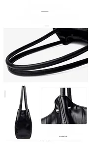 Detailed view of reinforced stitching and durable rivets on black leather tote bag handles