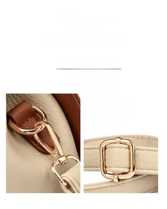 Détails de la quincaillerie dorée et du cuir grainé sur un sac à main beige