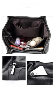 Detail view of large capacity dark grey tote with stone pattern and metal zippers
