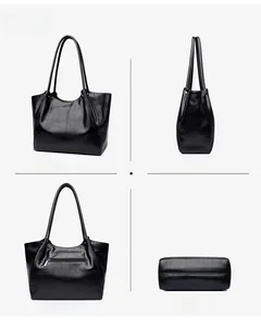 Multi-angle views of black crocodile pattern leather tote bag showing back zipper pocket