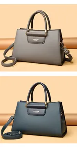 Détails de sacs cabas en cuir grainé gris et sarcelle avec des garnitures dorées