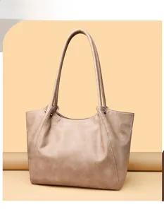 Detailed view of the khaki stone pattern leather texture on a stylish tote bag
