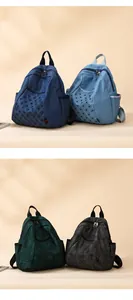 Detail showcasing four color variants of denim backpacks with rivets and quilted patterns