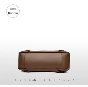 Detailed bottom view of brown textured leather handbag with neat stitching and solid base