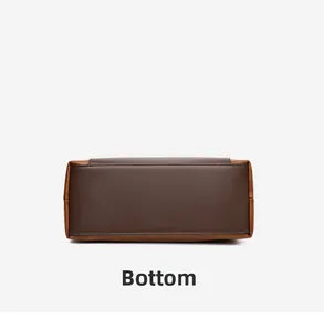 Detailed bottom view of brown leather handbag with reinforced stitching and dual-tone design