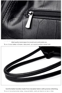 Detail of silver hardware zipper and precision stitching on black crocodile tote bag