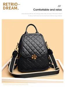 Close-up of vintage golden flower clasp and quilted leather texture on a black backpack