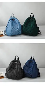 Detailed grid view of four vintage denim backpacks with punk metal rivets and quilted patterns