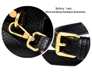 Detail of premium golden hardware and adjustable leather strap on black shoulder bag