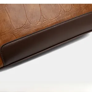 Detailed macro of the color-block base design on a vintage leather women's handbag