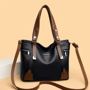 Chic black litchi pattern leather handbag with brown handles and silver kangaroo logo