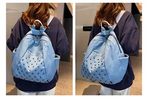 Detail view of light blue denim backpack with diamond stitching and black punk rivets