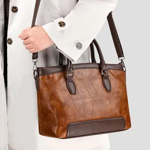 Retro brown crocodile embossed leather handbag with top handle and shoulder strap