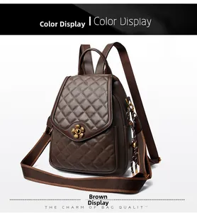 Detail of brown quilted leather backpack with gold flower clasp and woven pendant