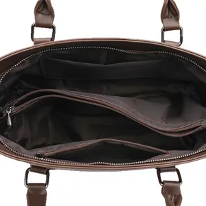 Deep brown leather handbag featuring multiple internal compartments and storage dividers