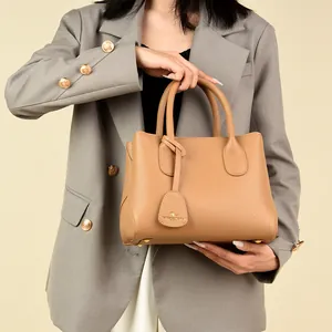 Commuter leather handbag in camel with kangaroo pendant and textured finish