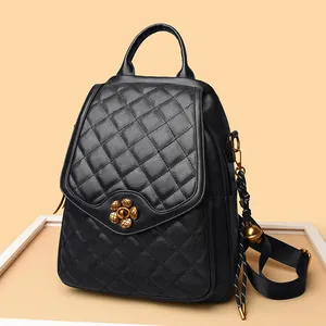 Quilted black leather backpack with vintage gold floral lock and elegant chain straps