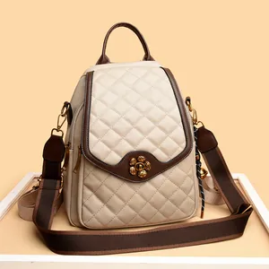 Cream quilted leather backpack with gold plum blossom lock and brown strap detailing
