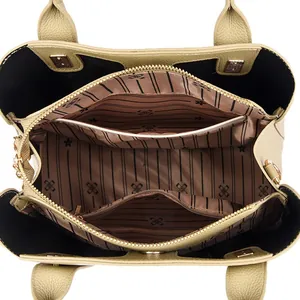 Premium leather bucket bag with multi-layer interior compartments and lychee grain texture