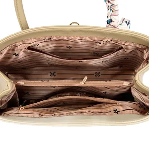 Beige leather Kelly bag interior with multiple compartments and striped lining texture