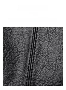 Macro detail of high-quality lychee grain leather and precise double stitching on tote bag