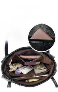 Detail view of large tote bag interior showing multiple compartments and spacious storage