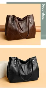 Macro detail of retro textured leather tote bags in brown and black with metal accents