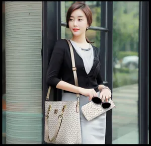 Close-up of the geometric horse shoe pattern on the stylish PU leather handbag and wallet