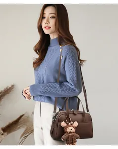 Brown litchi grain leather Boston bag with a cute bear charm and adjustable shoulder strap