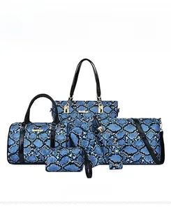 Detailed set of blue snakeskin pattern tote and matching travel handbags with gold hardware