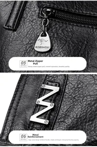 Macro detail of lychee grain leather, smooth metal zipper puller and reinforced hardware