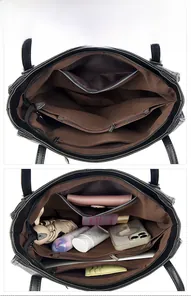 Detail view of the black leather tote bag featuring multiple internal compartments and brown lining