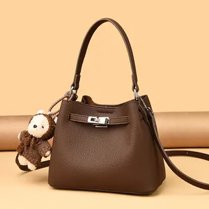 Women Retro Litchi Pattern Cowhide Bucket Bag With Metal Lock Practical Crossbody Shoulder Bag Versatile Tote With Plush Charm