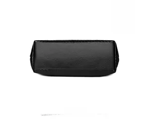 Detailed bottom view of black woven tote bag showing lychee grain leather texture and stitching
