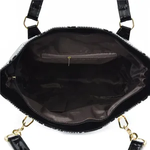 Faux snakeskin tote bag interior view with large capacity and zippered pocket