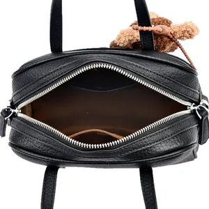 Black lychee pattern Boston bag with interior space, brown lining and teddy bear charm