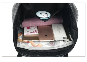 Interior view of large woven tote bag showing spacious capacity for tablets and books