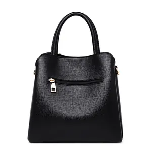 Classic black litchi grain leather bucket bag with top handle and gold zipper hardware