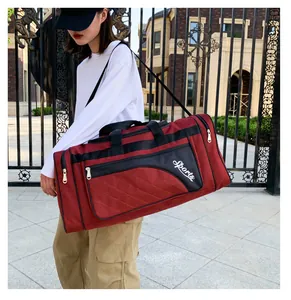 Quilted diamond lattice gym bag in red with black shoulder strap and Sports text