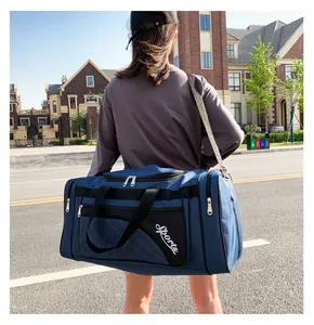 Deep blue large capacity sports travel bag with quilted stitching and shoulder strap