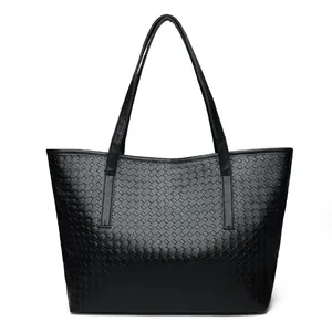Large black woven faux leather tote bag with sturdy double handles for daily commute