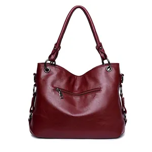 Sac à main classique en cuir bordeaux pour femme avec texture et fermetures éclair latérales