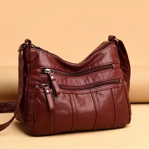 Borsa a tracolla bordeaux in morbida pelle con tasche multiple e tracolla regolabile