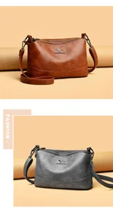 Detalle de bolsos tipo cubo de cuero con compartimentos y correas ajustables